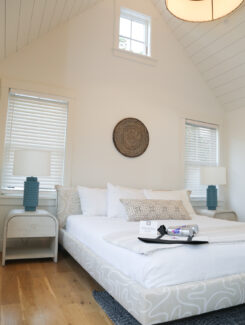 Guest room at Franklin Hotel featuring a king size bed, wooden floors and natural light