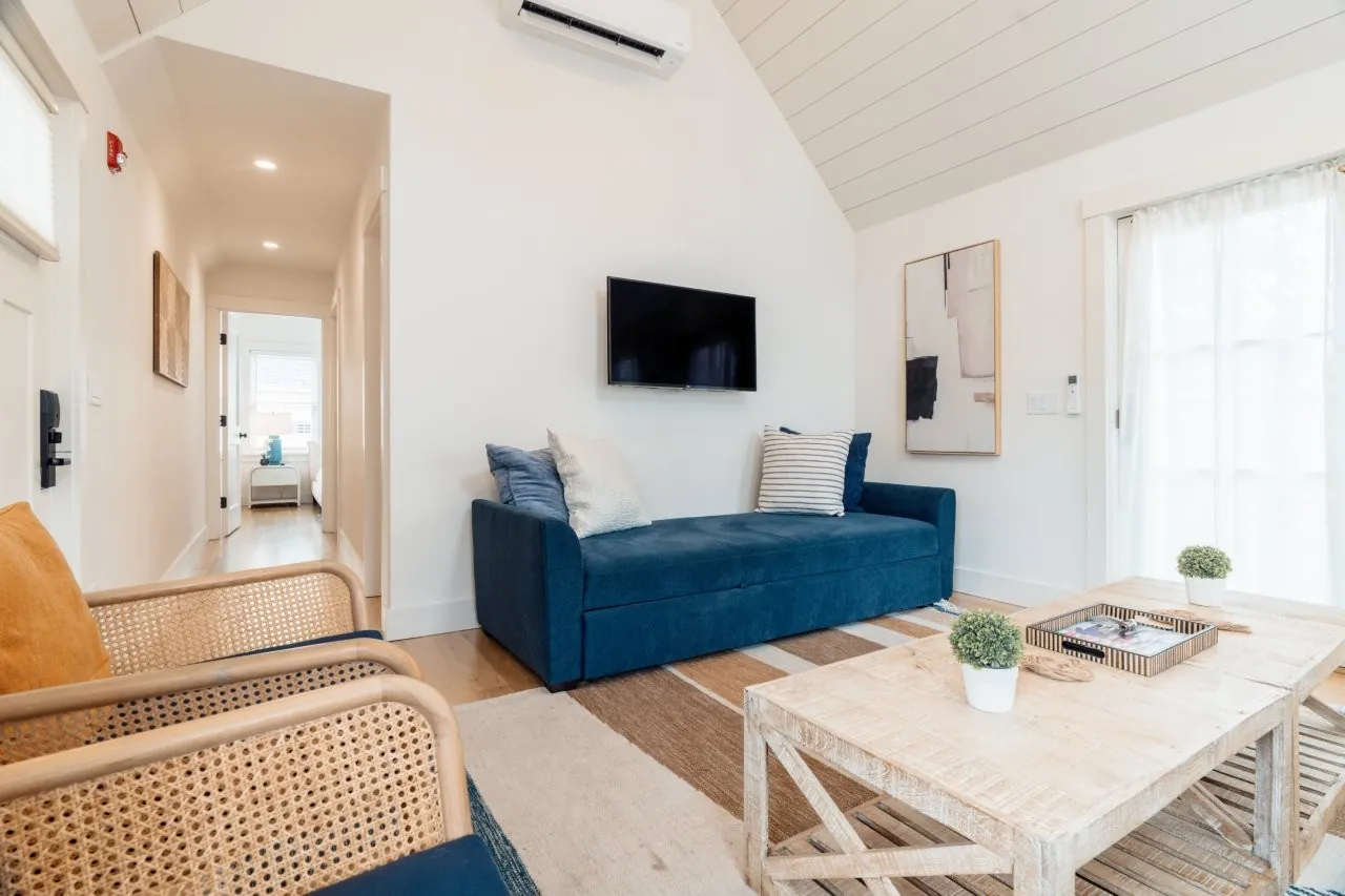 Living room with blue couch and modern decot