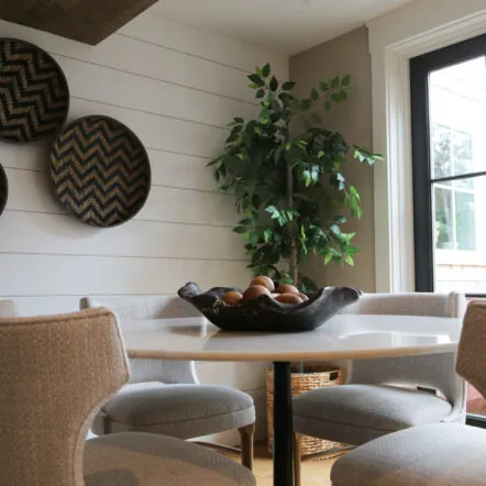 Lobby at Franklin Hotel with round table, chairs and wall baskets