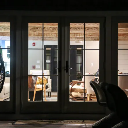 Night Time Photo Back Side with hanging chairs and glass doors