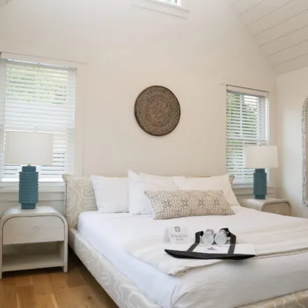 Bright bedroom at Franklin Hotel with white bedding and simple decor